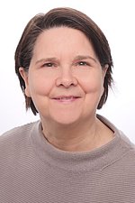 Bild von Susanne Wolf Portrait einer Frau mit braunen kurzen Haaren und einem beigen Pullover